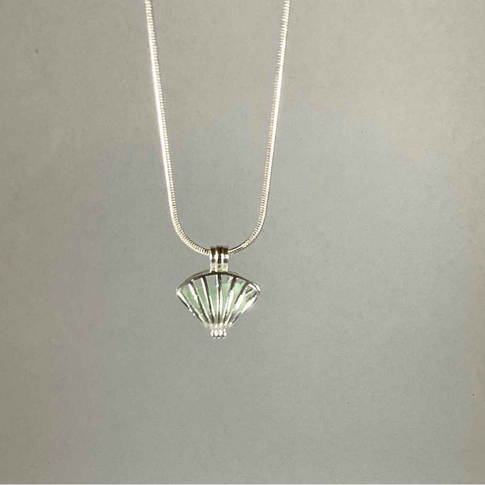 Sea foam green sea glass necklace in silver seashell locket